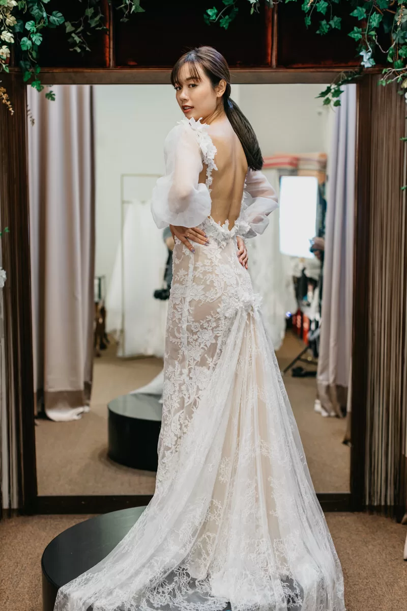 Model trying on one of Celine Ooi's elegant gowns during the photo shoot. by cliff choong