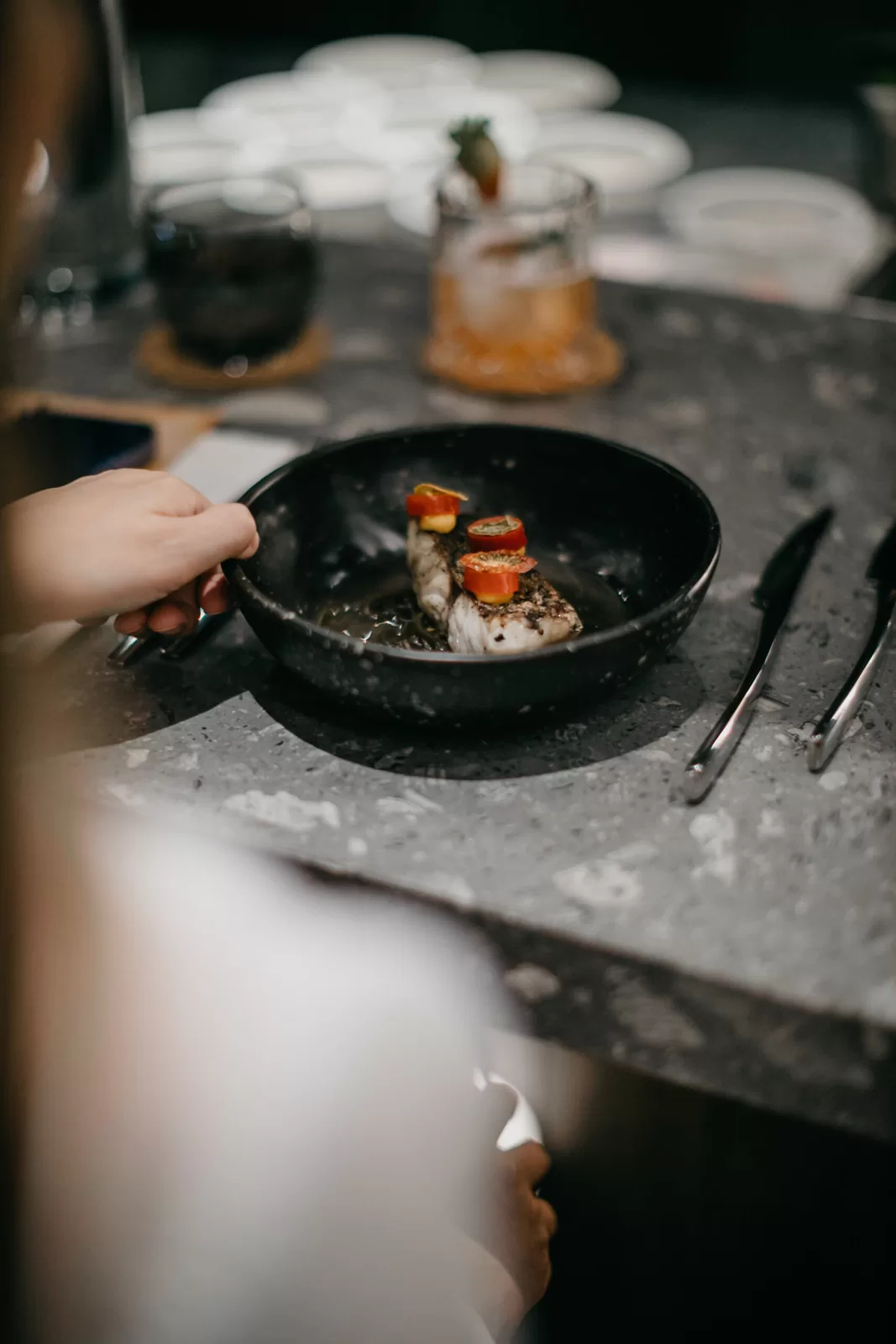 Chef Jun Wong showcasing his culinary expertise with a beautifully plated dish.
